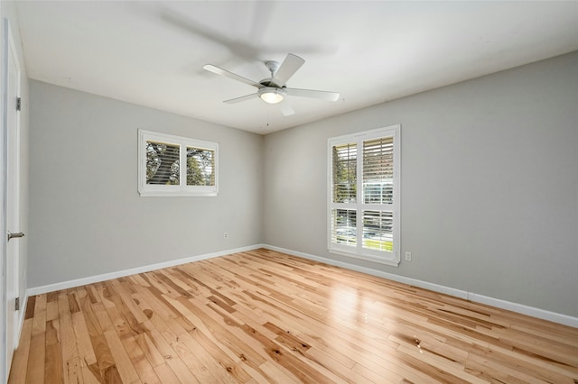 spare room featuring ceiling fan and light hardwood / wood-style flooring