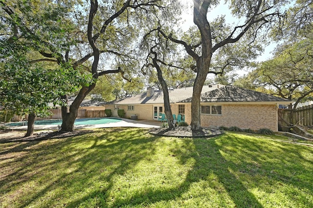 view of yard featuring a fenced in pool and a patio area