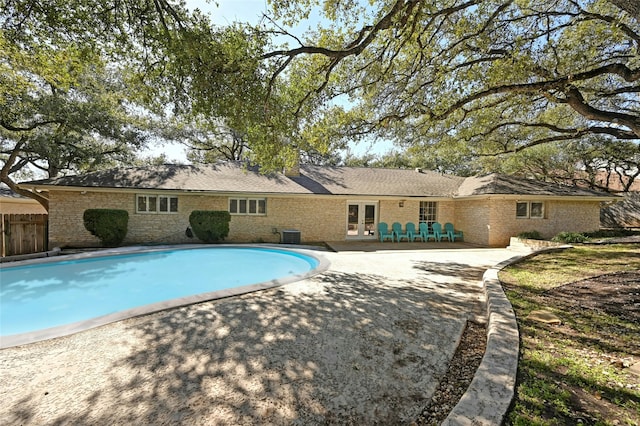 view of pool featuring central AC and a patio area