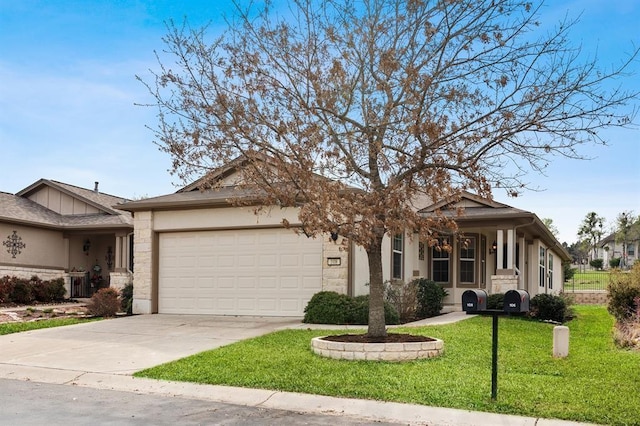 view of front of home with a garage and a front lawn