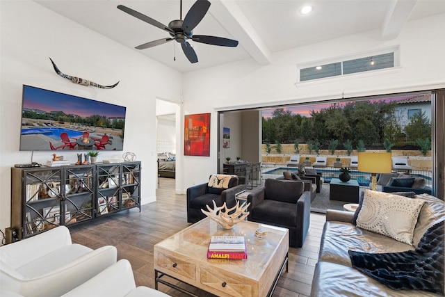 living room with wood-type flooring, ceiling fan, and beam ceiling