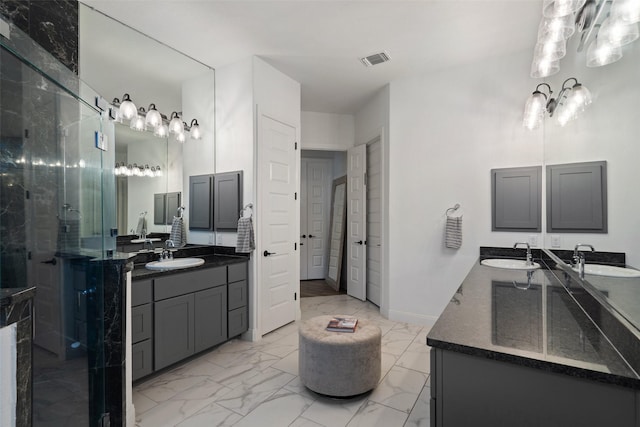 bathroom with walk in shower and vanity