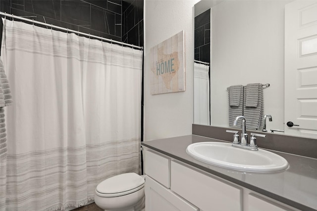 bathroom with vanity, toilet, and a shower with shower curtain