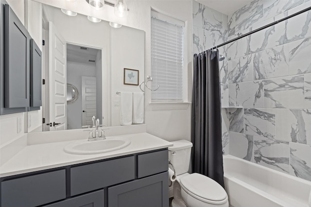 full bathroom featuring vanity, toilet, and shower / tub combo