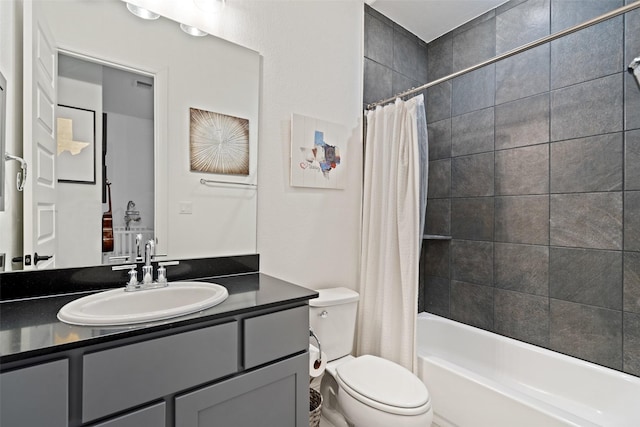 full bathroom with vanity, toilet, and shower / bath combo