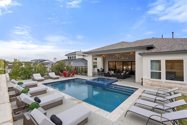 view of swimming pool with a patio area, outdoor lounge area, and an in ground hot tub