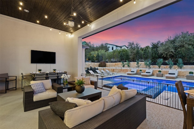 view of patio featuring an outdoor living space and a fenced in pool