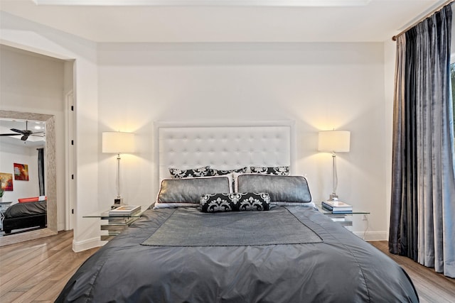 bedroom with hardwood / wood-style floors