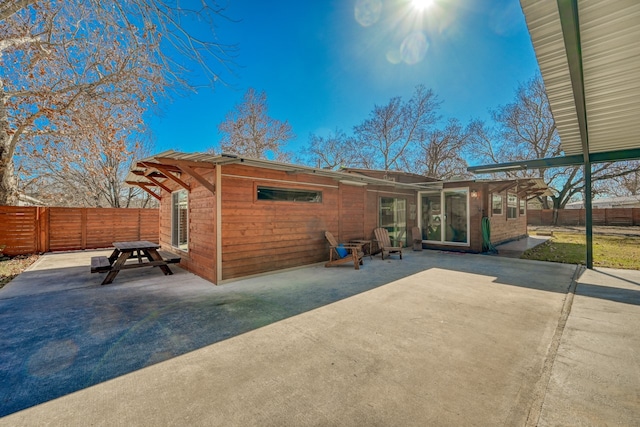 rear view of house featuring a patio