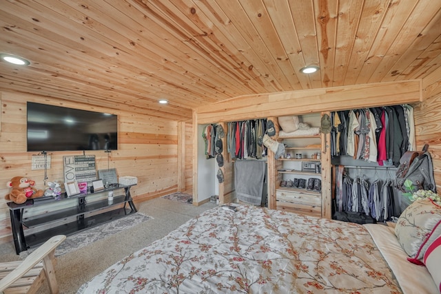 carpeted bedroom featuring wood ceiling, wooden walls, a closet, and vaulted ceiling