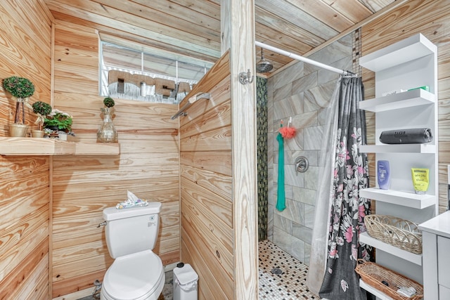 bathroom featuring a shower with shower curtain, wooden walls, and toilet