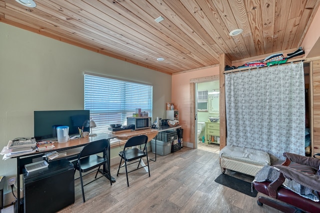 office space featuring light wood-type flooring and wood ceiling