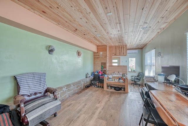 interior space featuring wooden walls, wooden ceiling, and light wood-type flooring