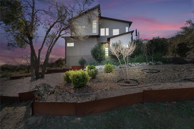 view of property exterior at dusk