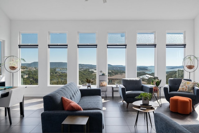 sunroom / solarium with a mountain view