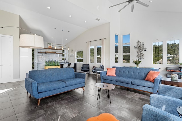 living room featuring high vaulted ceiling and ceiling fan