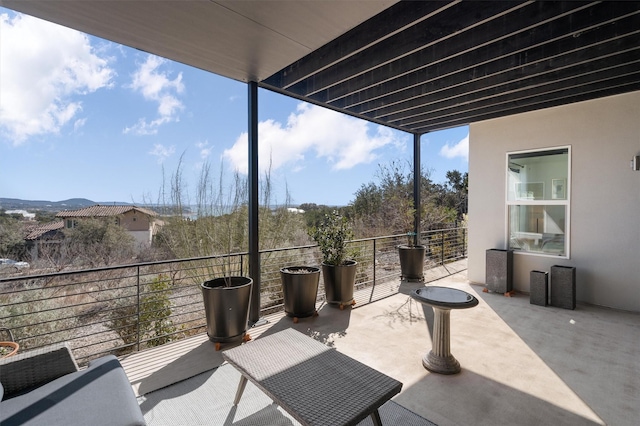 view of patio / terrace with a balcony