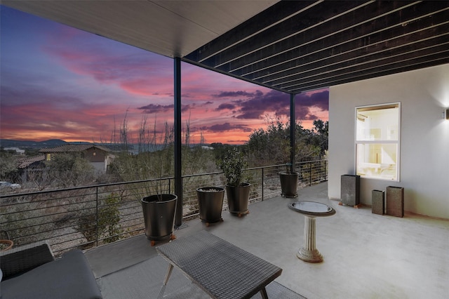 patio terrace at dusk with a balcony