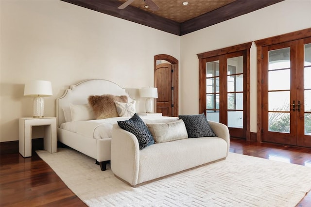 bedroom featuring french doors and wood finished floors