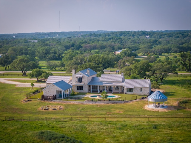 birds eye view of property featuring a rural view