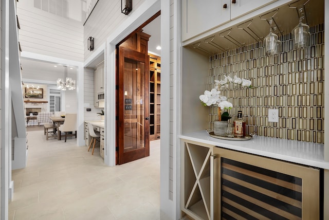 wine room featuring light tile patterned floors and beverage cooler