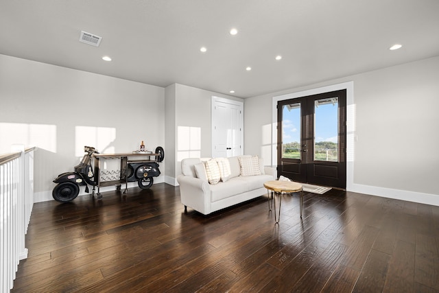 living room featuring dark wood-type flooring and french doors