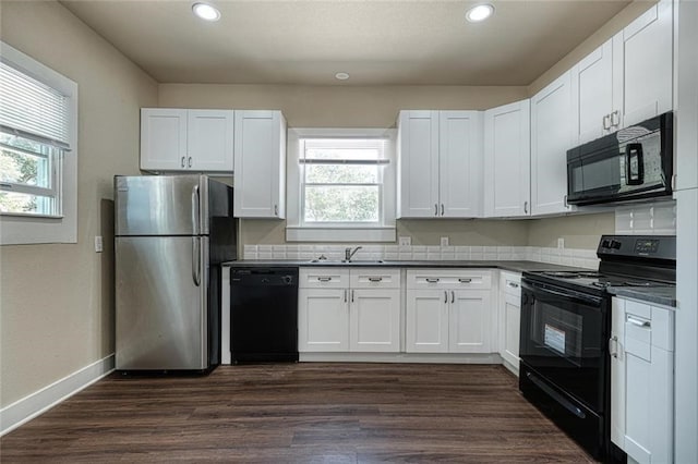 kitchen with black appliances, dark hardwood / wood-style floors, and white cabinets