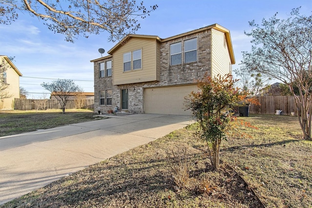 view of front of home with a garage and a front yard