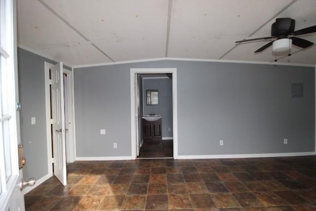 unfurnished room featuring crown molding, ceiling fan, and vaulted ceiling