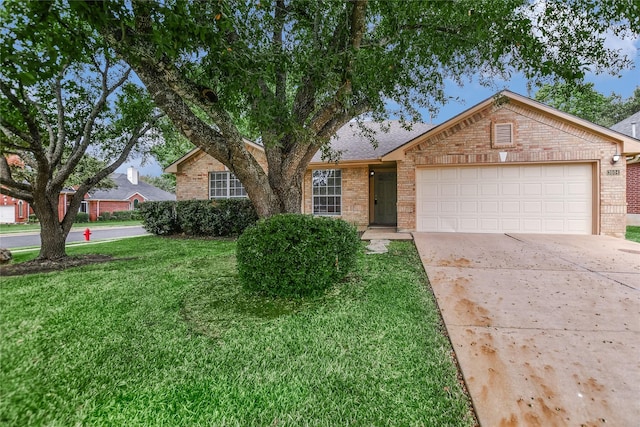 ranch-style house with a garage and a front yard