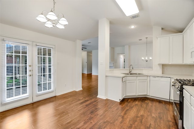 kitchen with white cabinets, white dishwasher, a chandelier, and stainless steel gas stove