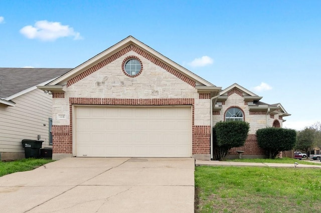 view of front of house featuring a garage and a front lawn