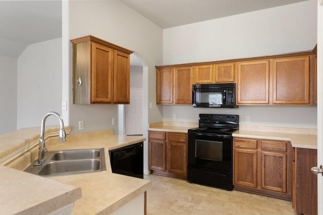 kitchen with sink and black appliances