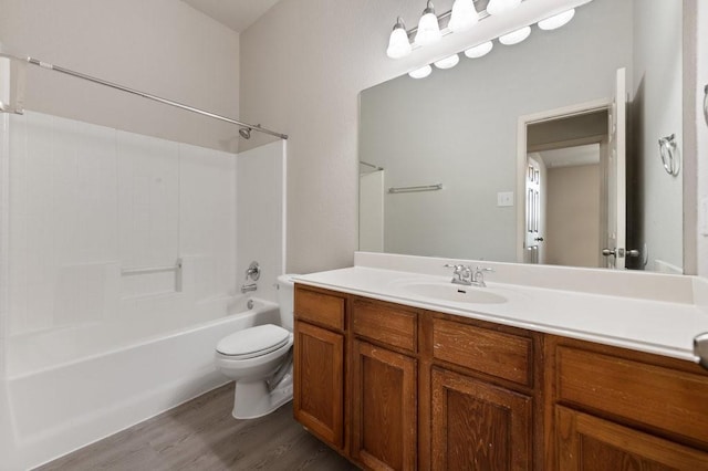 full bathroom with vanity, toilet, shower / bath combination, and hardwood / wood-style floors