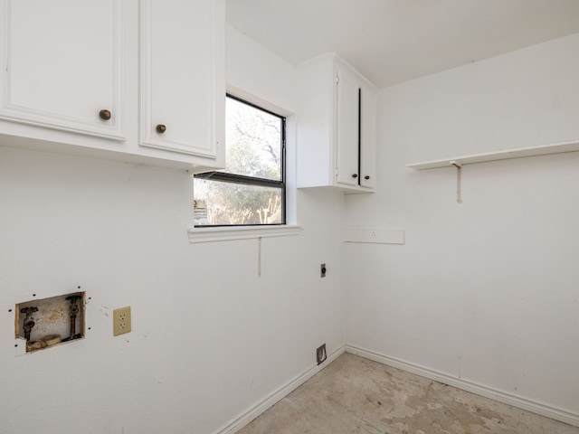 washroom with washer hookup, hookup for an electric dryer, cabinet space, and baseboards