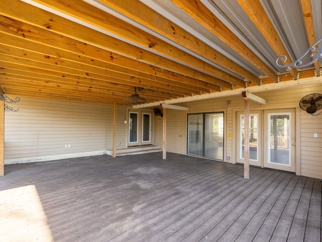 wooden terrace with a ceiling fan