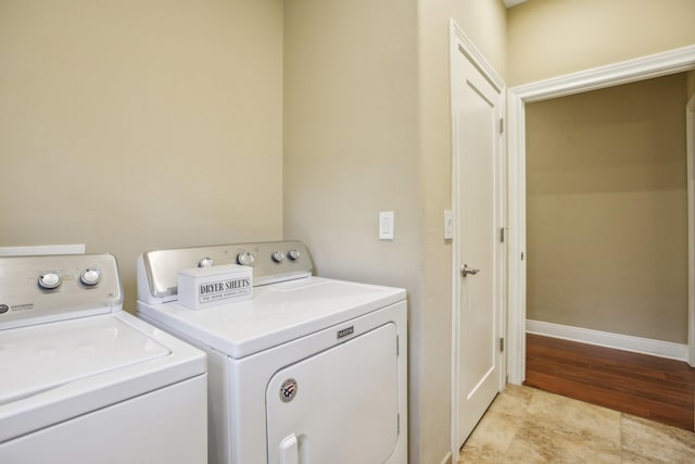 washroom featuring washing machine and clothes dryer