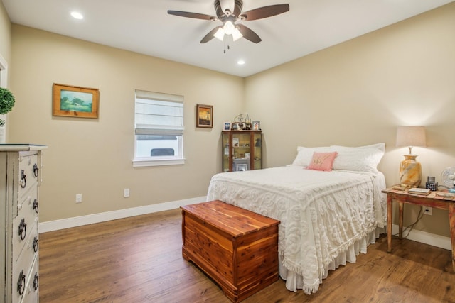 bedroom featuring dark wood-type flooring and ceiling fan