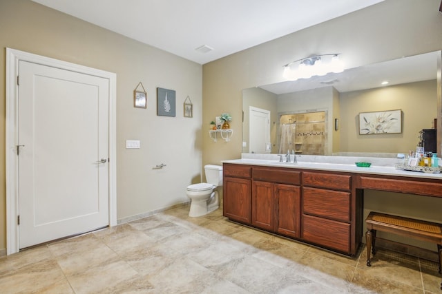 bathroom with vanity, toilet, and walk in shower