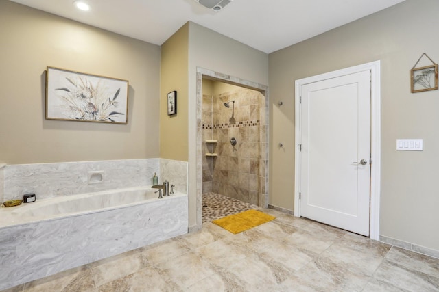 bathroom featuring independent shower and bath