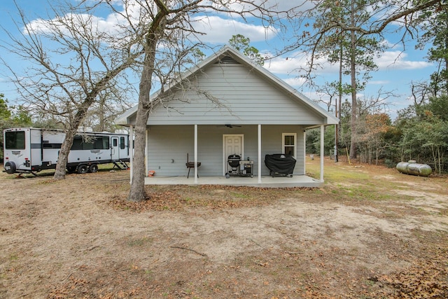 exterior space with ceiling fan and a patio area