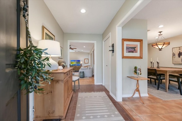 hall with tile patterned flooring