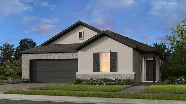 view of front of home featuring a garage and a lawn