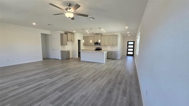 unfurnished living room featuring recessed lighting, visible vents, ceiling fan, and light wood finished floors