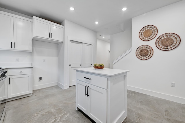 kitchen with white cabinetry and a center island