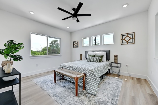 bedroom featuring ceiling fan and light hardwood / wood-style floors