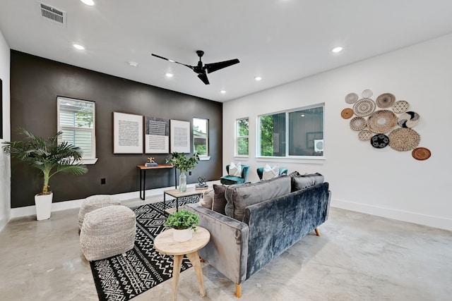 living room with plenty of natural light and ceiling fan