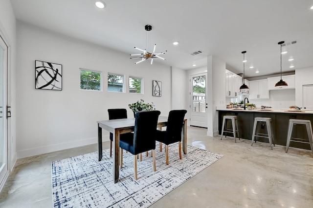 dining room featuring a chandelier