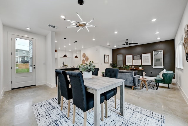 dining space with a chandelier