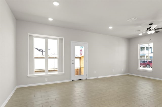 unfurnished room with light hardwood / wood-style floors and ceiling fan